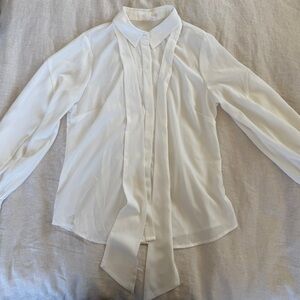 Riley & Rae Balloon sleeve flowy blouse with bow necktie.